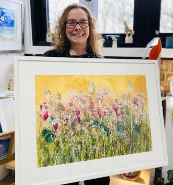 Artist and art tutor Clare Tebboth with her new painting Colourful Day - watercolours, framed original