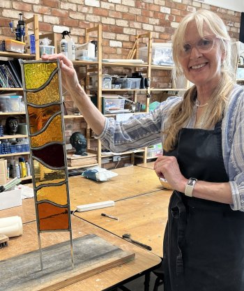 Student Gary preparing his panel for cementing - to make it weatherproof