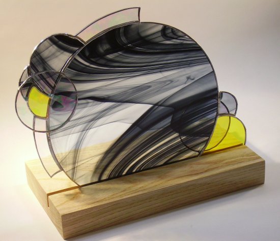 Geo Orbit stained glass art on a wooden base