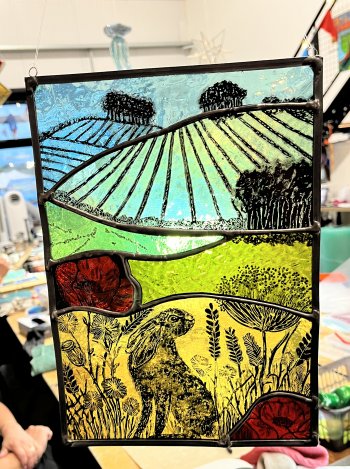 A beautiful paintred stained glass panel made by student Jo with Vitreus Art